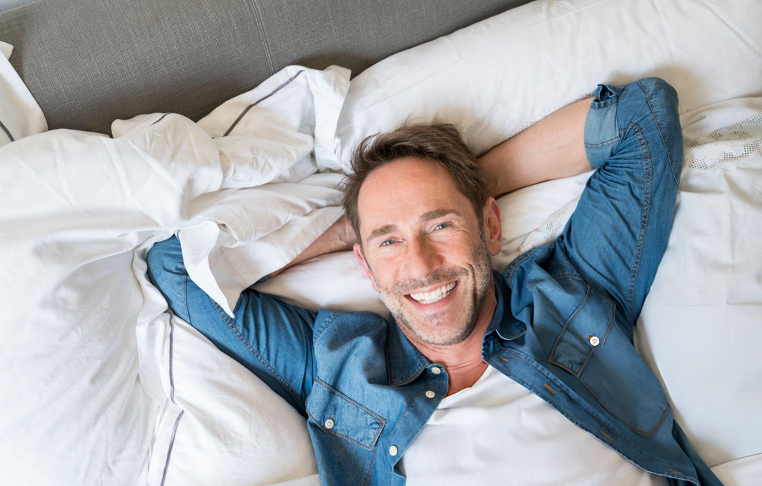 confident man lying in bed